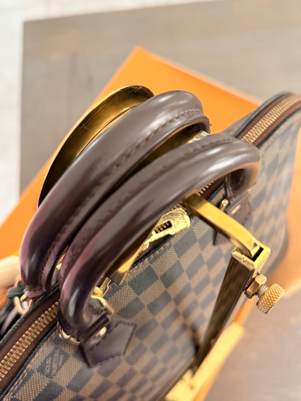 Louis Vuitton Alma Ebene PM Made in France Gold Hardware